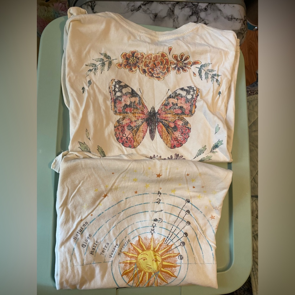 Two piece oversized “Others Follow” tees in size XS.